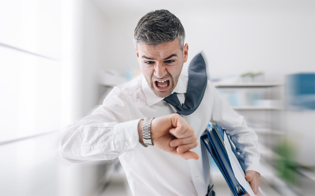 Businessman in a hurry checking time.