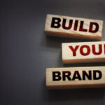 Wooden blocks spelling "Build Your Brand"